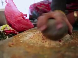 CU Woman preparing her lunch / Durma, Banke District, Nepal Stock Footage