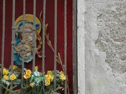 MH LD Flowers in Shrine of Virgin Mary and Baby Jesus / Venice, Italy Stock Footage