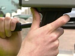 Police Officers Monitor Traffic with Speed Guns News Clip