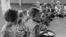 1960 MONTAGE Young children playing drums and tambourines / United Kingdom Stock Footage