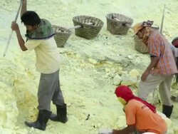 MS Miners working at the sulfur extraction on the Ijen volcano / Ijen, Java, Indonesia Stock Footage