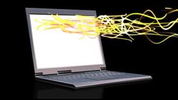 Abstract light rays are ejected and float away from a white screen of a laptop computer. Stock Footage