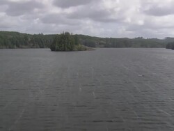 WS AERIAL View of Sitcoos Lake with trees / Oregon, United States Stock Footage