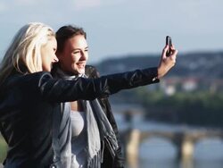 two women taking their own photo Stock Footage