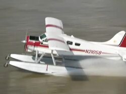 AERIAL ZI ZO Seaplane landing on mississippi river/ New Orleans, Louisiana, United States Stock Footage