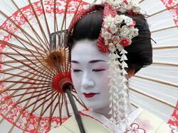 Beautiful Japanese Geisha girl enjoying having her Photograph taken, Japan, Asia Stock Footage