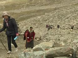 Block Shot Pilgrims Performing Circumambulation Lhasa Tibet China  Stock Footage