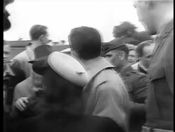 B/W 1944 young Frank Sinatra surrounded by crowd at golf competition raising funds for War Bonds Stock Footage