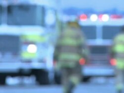 Fire Trucks & Firemen Defocused Stock Footage
