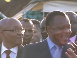 Jacob Zuma and Muammar Gaddafi stood talking News Clip