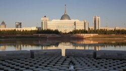 Central Asia, Kazakhstan, Astana, View of city reflecting in Isahim River and Ak Orda Presidential Palace Stock Footage