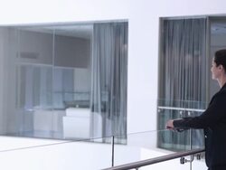  DS Businesswoman looking over interior railing, then turning and smiling / Seattle, Washington, United States Stock Footage