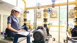 Female stationary engineer at work with notebook Stock Footage