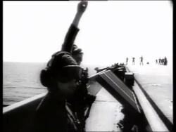 B/W ground crew signals airplanes on aircraft carrier / 1960's / Enterprise / Vietnam / SOUND Stock Footage