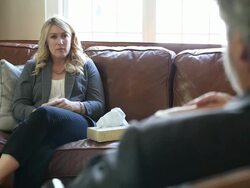 She dabs away tears and listens to therapist Stock Footage