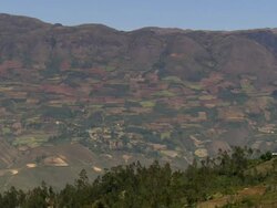 "Mountain range and hill with patchwork quilt of fields and forested areas, Amazonas region of Peru [PerÃƒÂº]" Stock Footage