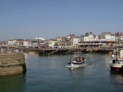 HARBOUR ENTRANCE AND PLEASURE BOAT RIDES Stock Footage