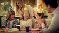 SLO MO birthday girl blowing out candles for tenth birthday Stock Footage