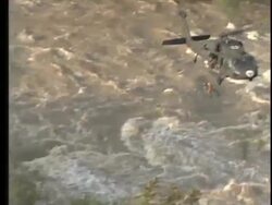 Kayakers rescued from flooded river Stock Footage