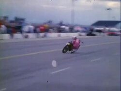 Female motorcycle stunt driver mishap Stock Footage