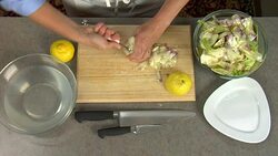 Overhead preparation of an artichoke stalk for a food recipe. Stock Footage