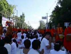 Many people give food and drink for alms to 1,536 Buddhist monks Stock Footage