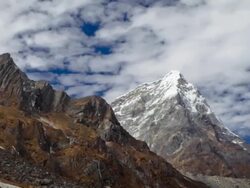Panning shot of Time-lapse of rocky Himalayan peaks and passing clouds. Stock Footage