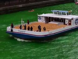 Chicago River Dyed Green In St. Patrick's Day Tradition Stock Footage