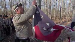 Civil war enthusiasts in flag raising ceremony News Clip