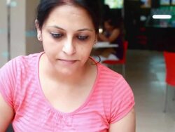 Indian Mother and Daughter in Conversation While Eating Out Stock Footage