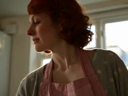 CU TU TD Shot of woman breaking eggs in bowl sieving flour and mixing / London, Greater London, United Kingdom Stock Footage