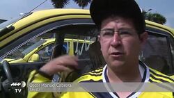 VOICED : Miles de taxistas protestan contra Uber en Bogota News Clip