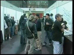 Tattoo professionals and fans at convention News Clip