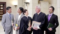 Judges and lawyers smiling in courthouse Stock Footage