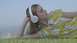 Young woman listening music Stock Footage