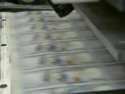 CU ZO Sheets of one hundred dollar bills going through roller / Washington D.C., Washington D.C., United States Stock Footage