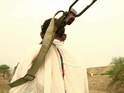 Afar men carrying guns Stock Footage