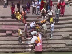 WS ZI People ritualistically tending to body of  deceased woman  / Kathmandu, Central, Nepal Stock Footage