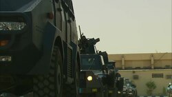 Armored vehicles travel in single file. Stock Footage