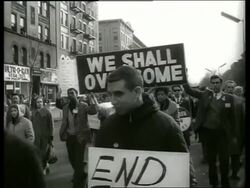 B/W 1960's civil rights march in city street / SOUND Stock Footage