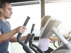 Training on a cardio machine Stock Footage