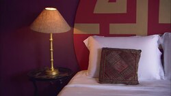 A lamp glows on a nightstand in a La Maison Hotel room in Rio de Janeiro. Stock Footage