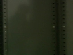 MS POV Film cans on shelf / Berkhamsted, Hertfordshire, United Kingdom   Stock Footage