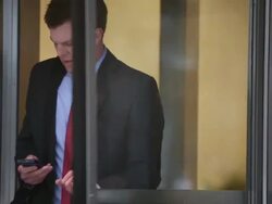 MS Well dressed young man walking through revolving door inside building in downtown urban area / Minneapolis, Minnesota, United States Stock Footage