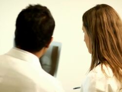 Doctors consults over an X-ray Images Stock Footage