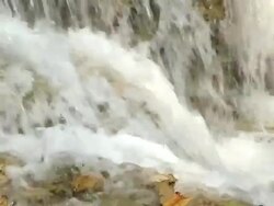 CU SLO MO Shot of Water flowing quickly and falling / Kuang Si, Luang Prabang, Laos  Stock Footage