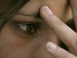 Close-up of a serious, young woman thinking deeply. Stock Footage