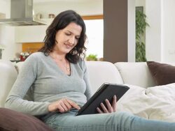 HD DOLLY: Woman Using Tablet At Home Stock Footage