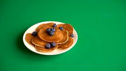 Stack of pancakes with fresh blueberry on green screen Stock Footage