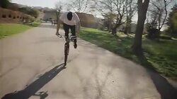 young man drive a bike on first wheel,backwards Stock Footage